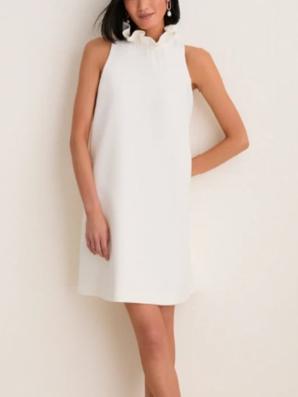 Tuckernuck Blythe Sleeveless Ruffle-Neck Dress in cream/ivory with back bow tie